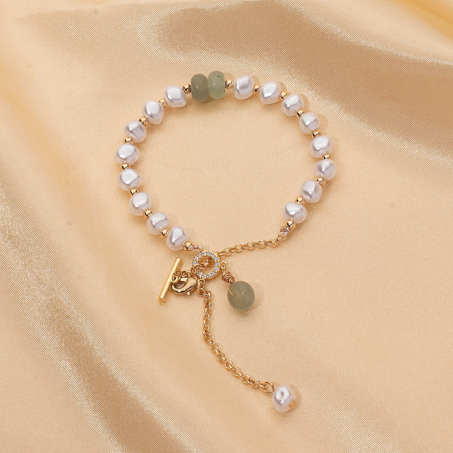 LNCHRAN Golden Plated Faux Pearl Bracelet with Green Stone and Synthetic Zircon Toggle