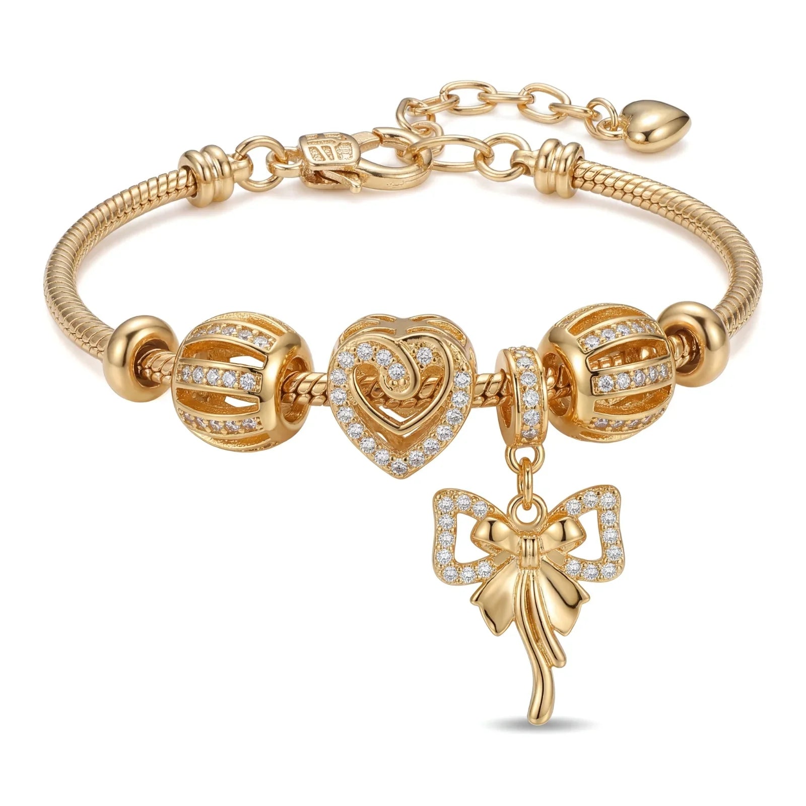 Gold charm bracelet with heart and bow pendant, studded with crystals, elegant jewelry