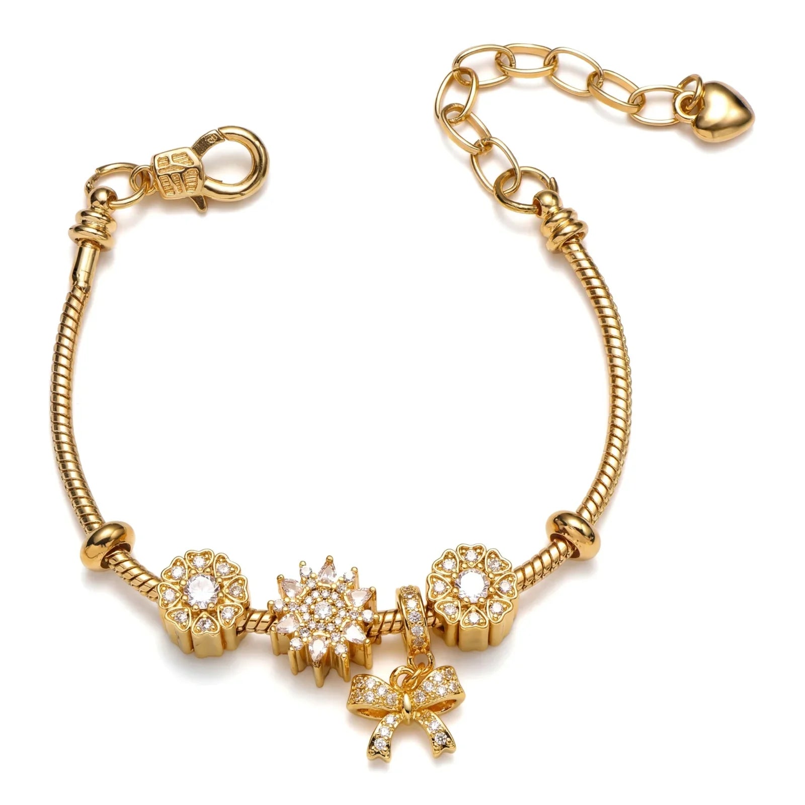Gold charm bracelet with crystal bow and floral accents, minimalist jewelry on white background