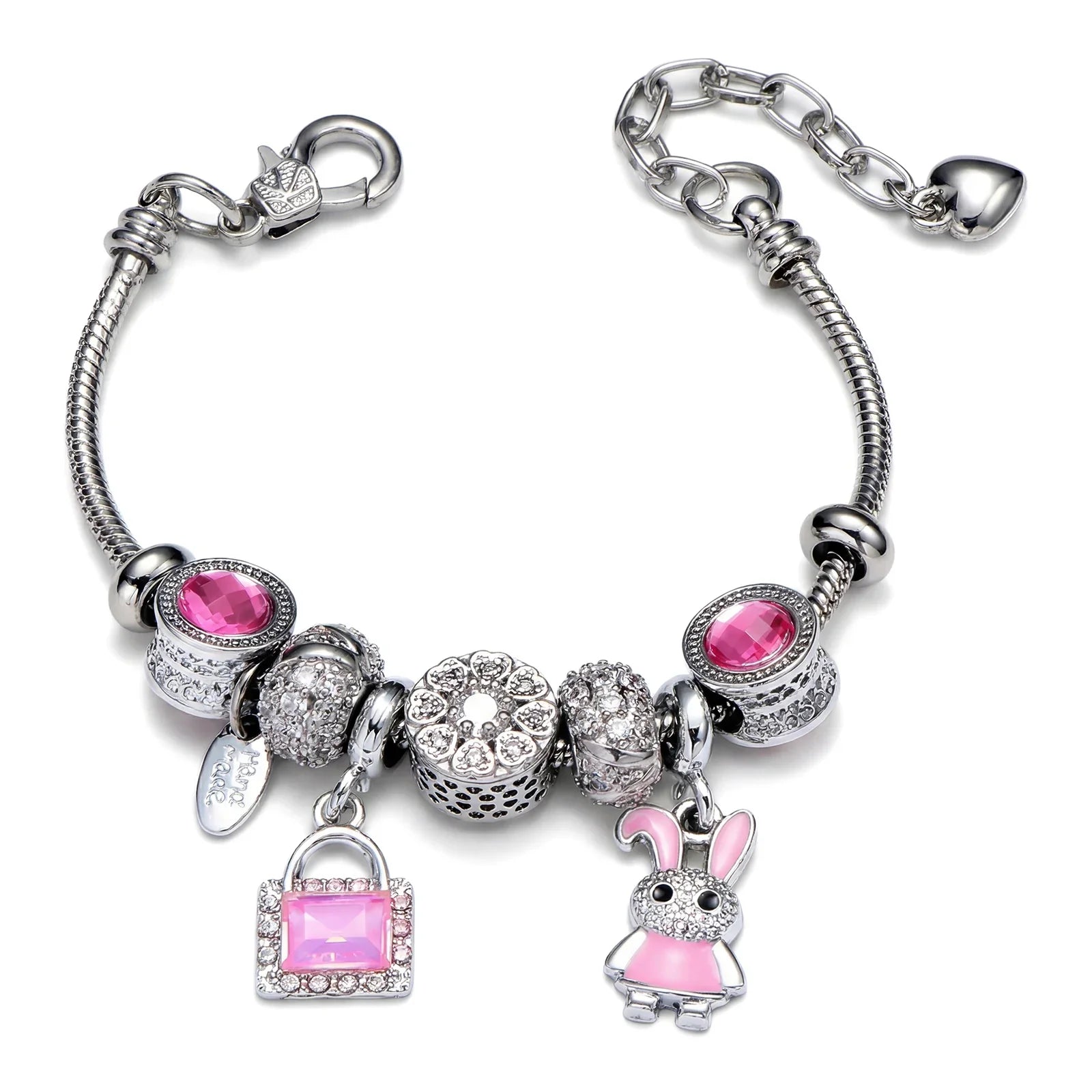 Silver charm bracelet with pink gemstones, crystal beads, purse and bunny charms on white background