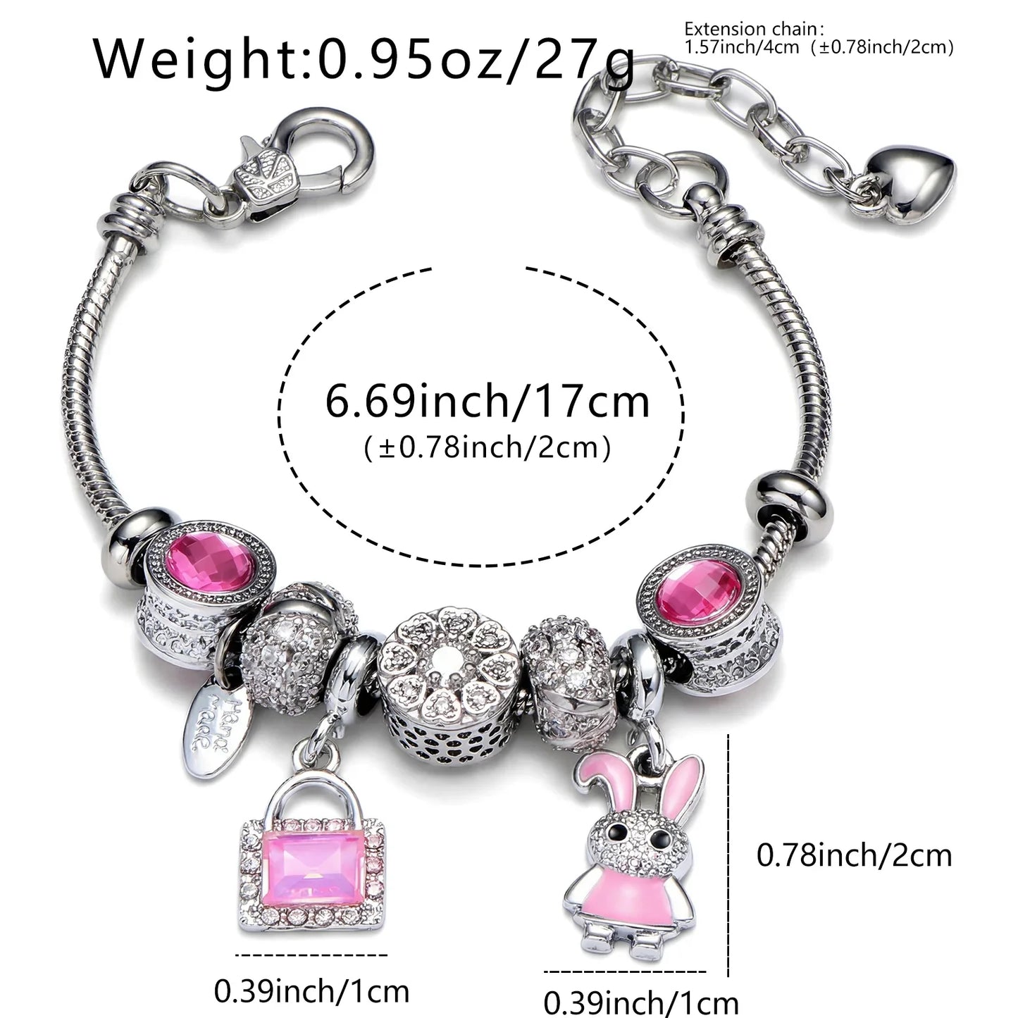 Silver charm bracelet with pink gemstone accents, handbag and bunny charms, 17cm length.