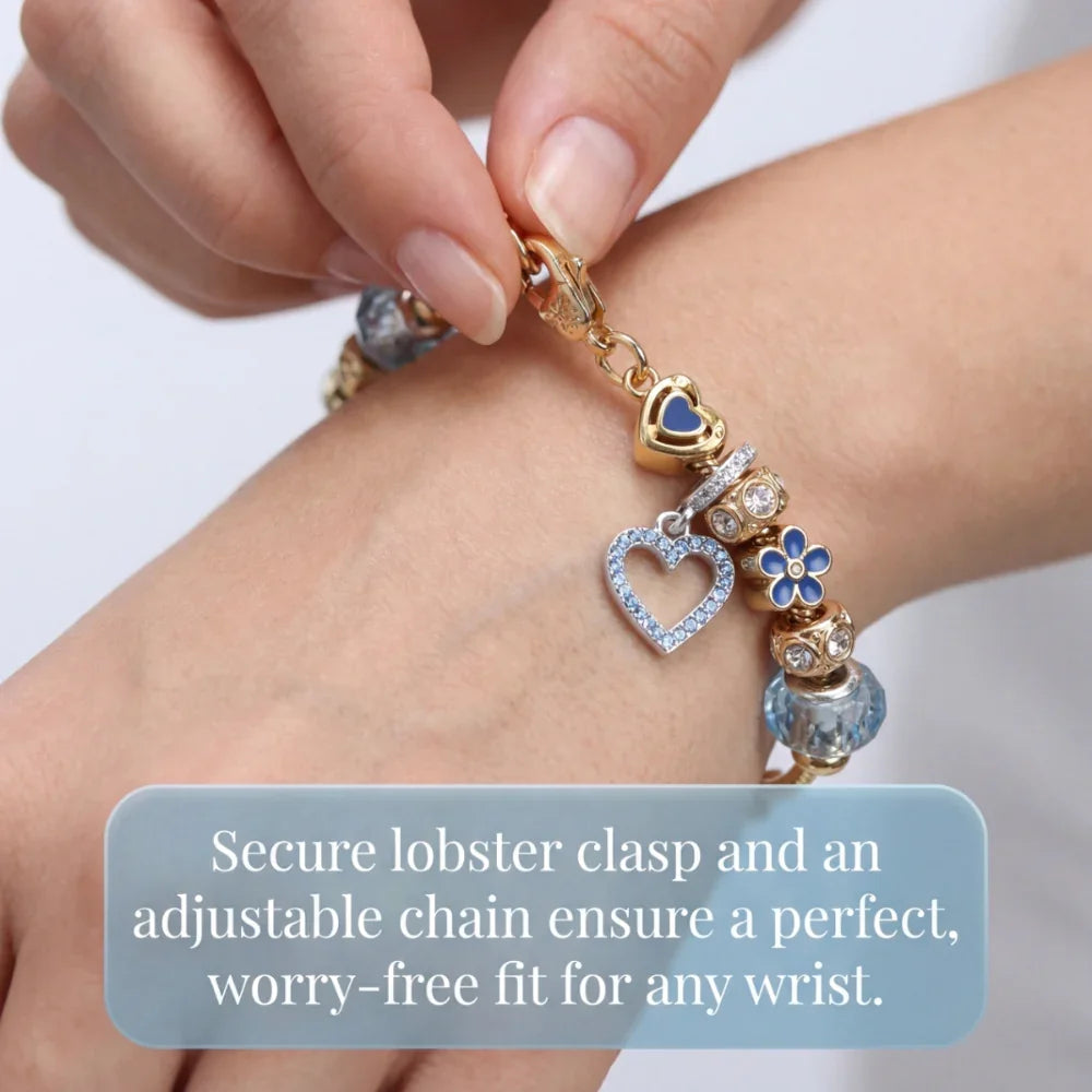 Hand fastening gold charm bracelet with heart and flower charms, adjustable lobster clasp